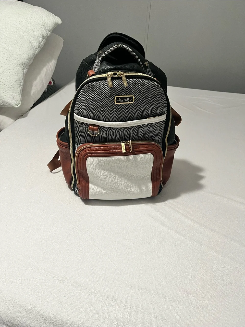 Itzy Ritzy Baby Diaper Bag Backpack in Black, White, brown with wipes case